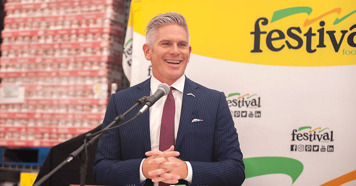 man speaking on podium