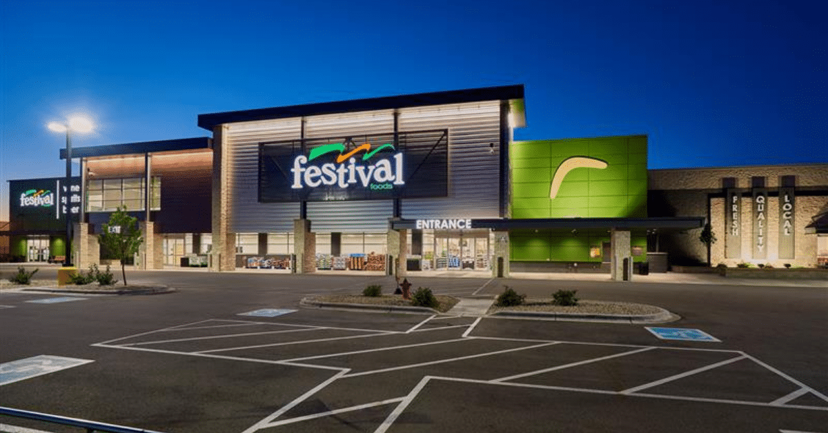 Grocery storefront at night with Festival Foods