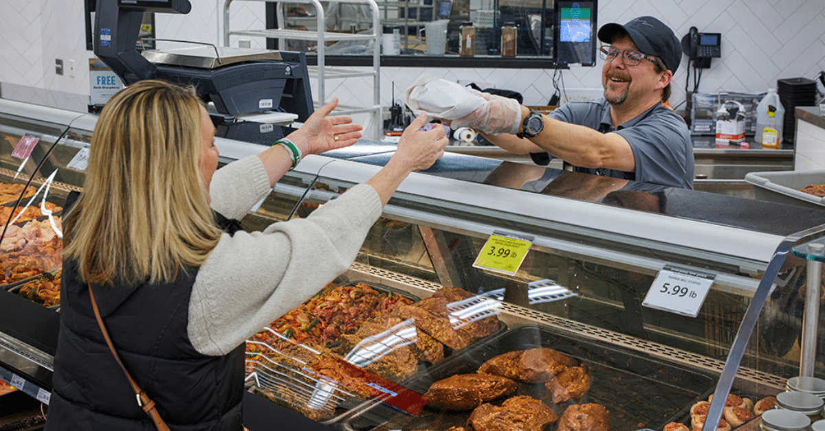 associate at meat counter