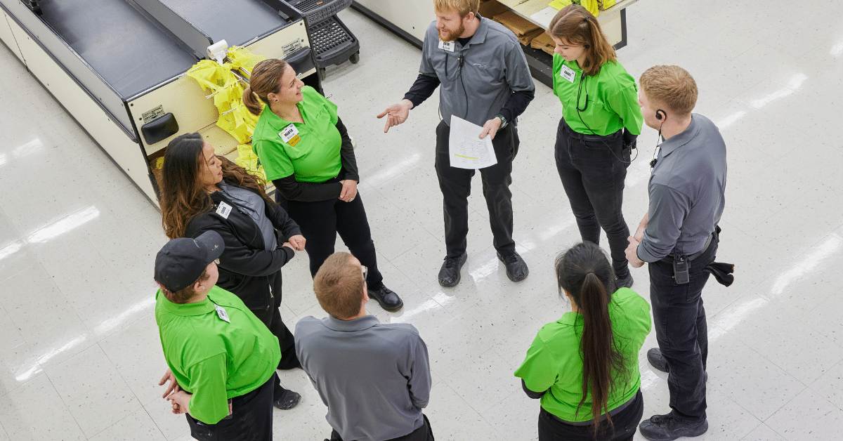 associates standing in circle