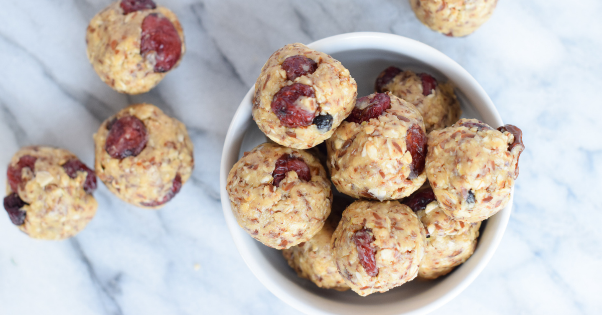 Oat and dried fruit energy balls in a white bowl
