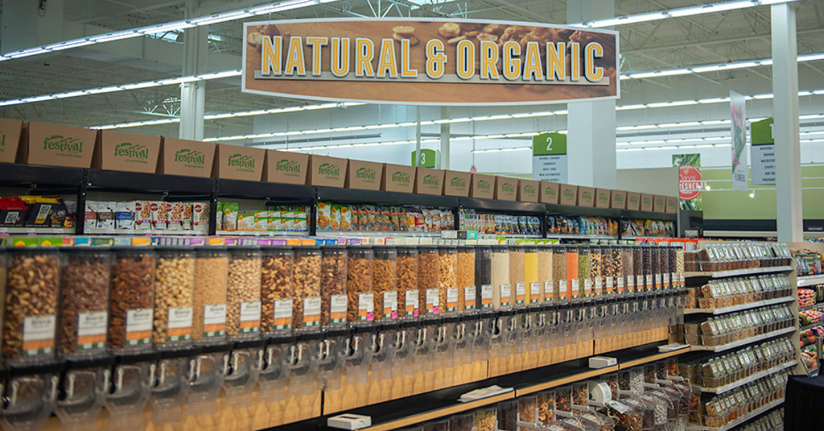 Bulk item aisle in grocery store with Natural & Organic sign hanging above